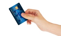 Credit Card in hand, isolated on white background